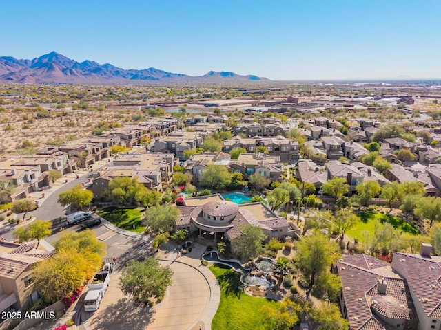 birds eye view of property featuring a mountain view