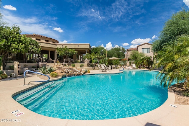 view of pool featuring a patio area