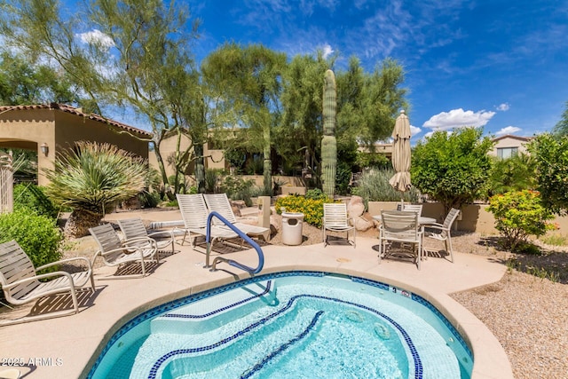 view of pool featuring a patio