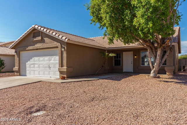 ranch-style house featuring a garage