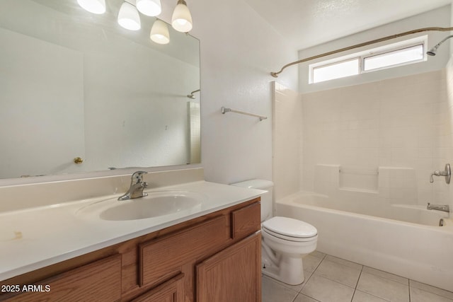 full bathroom with vanity, bathtub / shower combination, tile patterned floors, and toilet