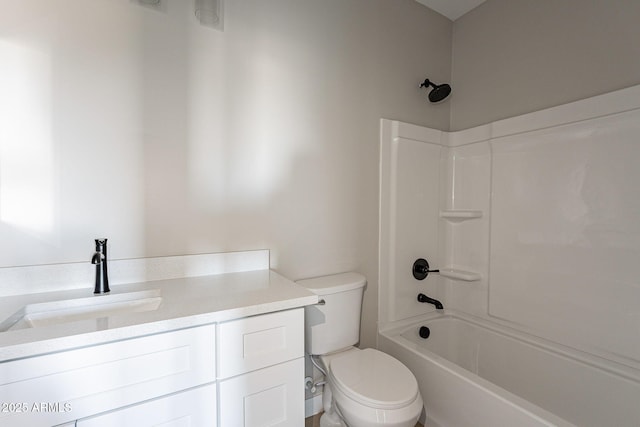 full bathroom with tub / shower combination, vanity, and toilet