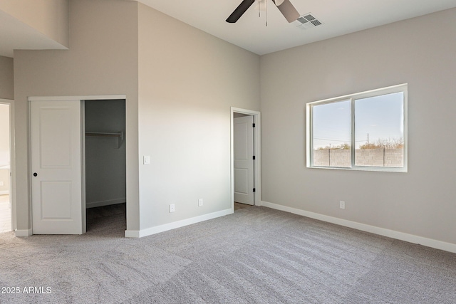 unfurnished bedroom featuring baseboards, visible vents, and carpet flooring