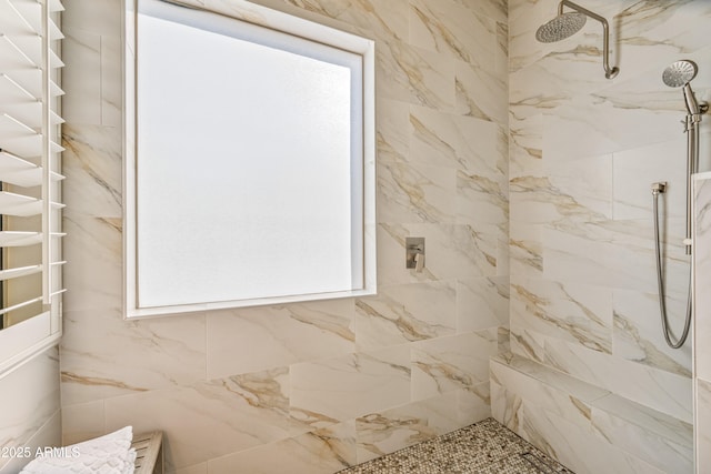 bathroom featuring tiled shower