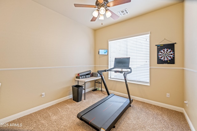 workout area with light carpet and ceiling fan