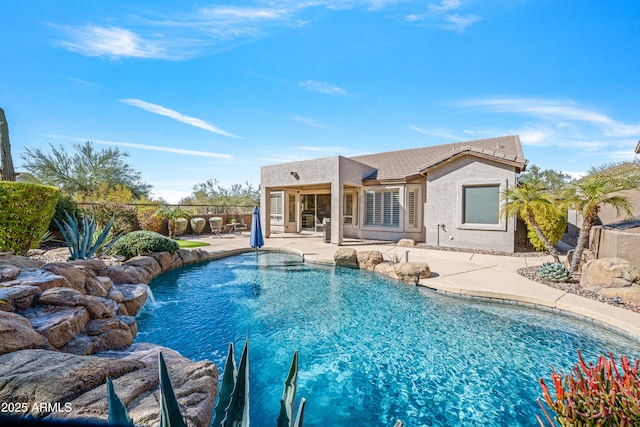 view of pool featuring a patio and pool water feature