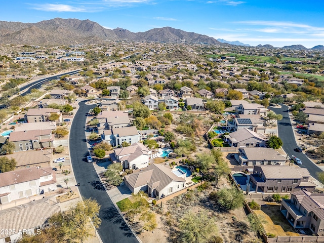 birds eye view of property with a mountain view