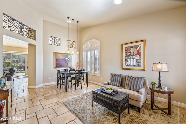 living room with a towering ceiling