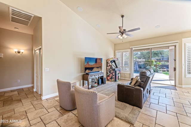 living room with high vaulted ceiling and ceiling fan