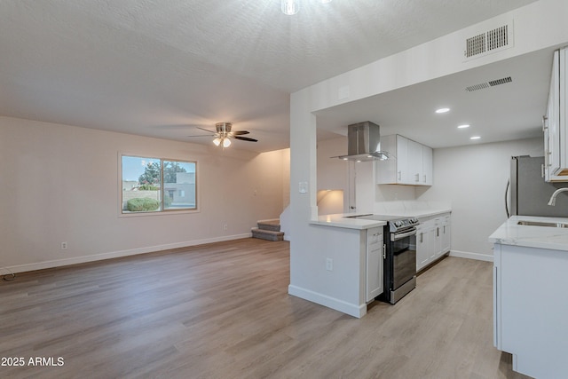 kitchen featuring sink, extractor fan, white cabinetry, stainless steel appliances, and light hardwood / wood-style floors