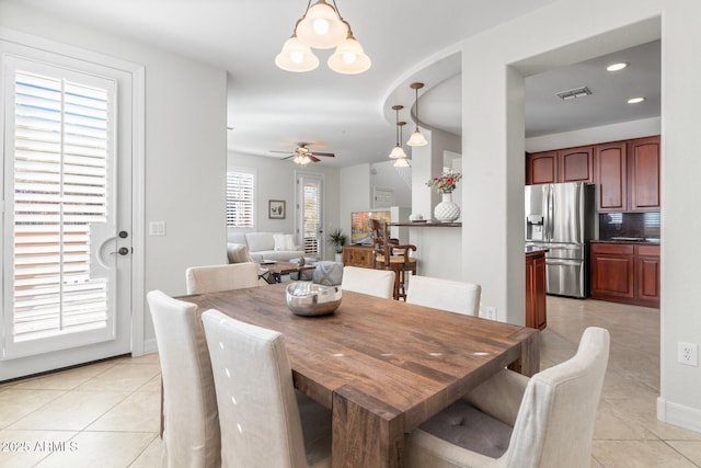 dining room with ceiling fan and light tile patterned floors