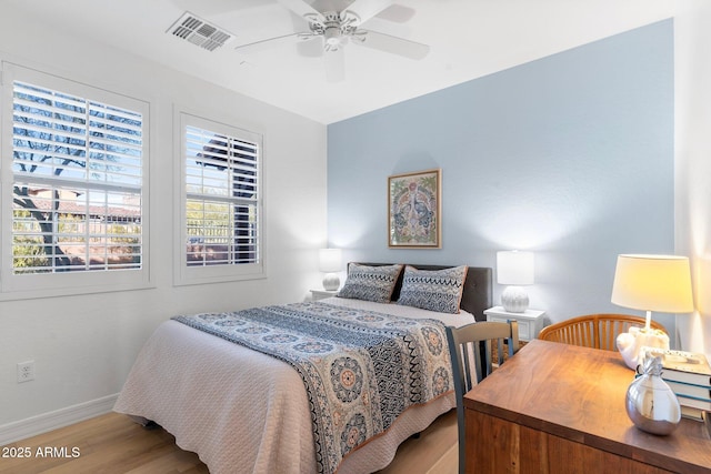 bedroom featuring ceiling fan and light hardwood / wood-style flooring