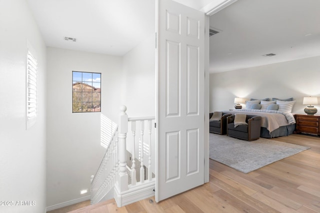 bedroom with light wood-type flooring