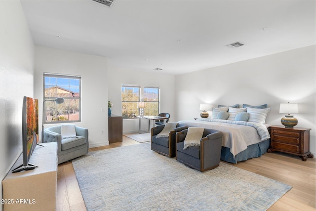 bedroom with light hardwood / wood-style floors