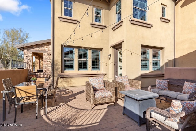 wooden deck with outdoor lounge area and a patio area