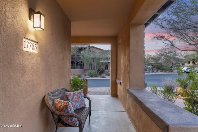 view of patio terrace at dusk