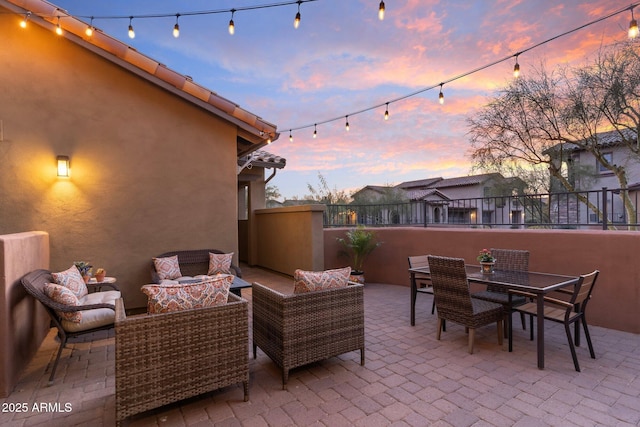 patio terrace at dusk with an outdoor living space