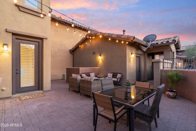 patio terrace at dusk with an outdoor hangout area