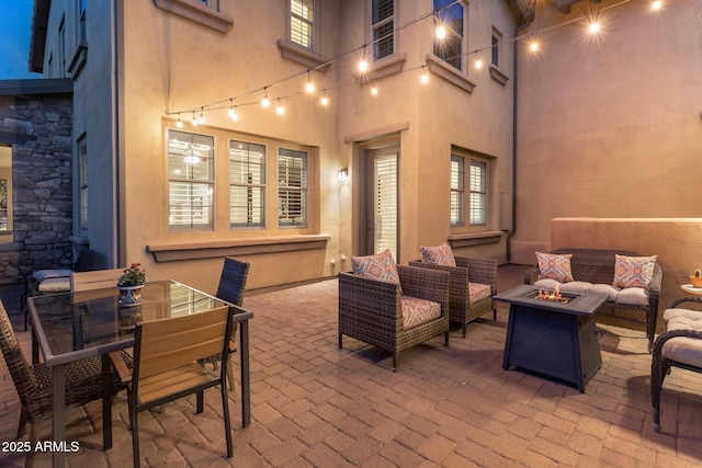 view of patio / terrace featuring an outdoor living space with a fire pit