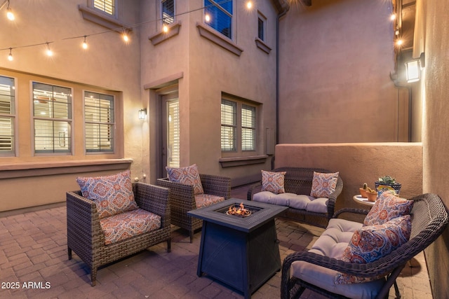 view of patio / terrace featuring an outdoor living space with a fire pit