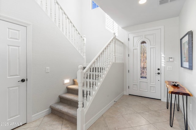 entrance foyer featuring light tile patterned floors