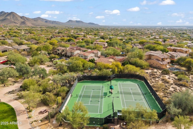 birds eye view of property with a mountain view