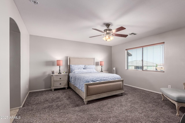 509 S 111th Dr, Avondale, AZ 85323 - carpeted bedroom featuring arched walkways and ceiling fan