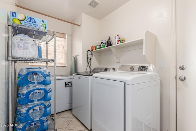 509 S 111th Dr, Avondale, AZ 85323 - laundry room with independent washer and dryer and light tile patterned floors