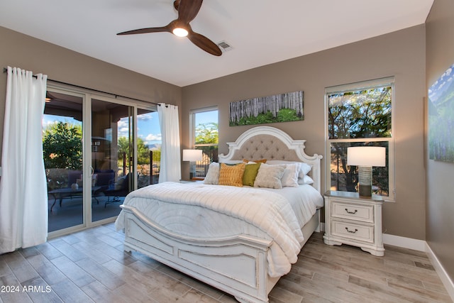 bedroom with light hardwood / wood-style floors, access to outside, and ceiling fan