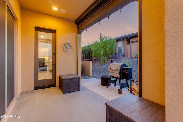 patio terrace at dusk with area for grilling