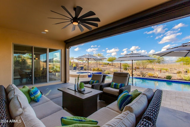 view of patio with a fenced in pool, outdoor lounge area, and ceiling fan