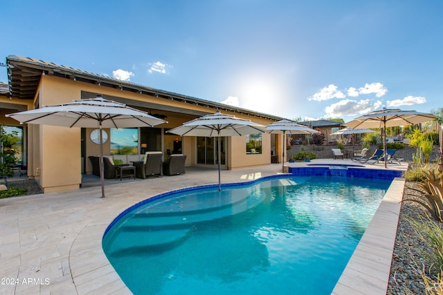 view of swimming pool with a patio