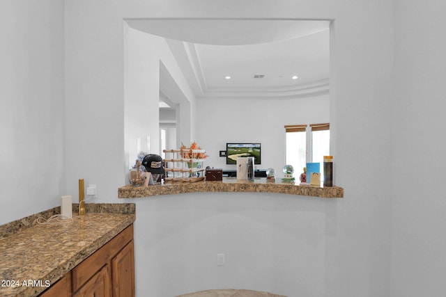 kitchen featuring stone counters