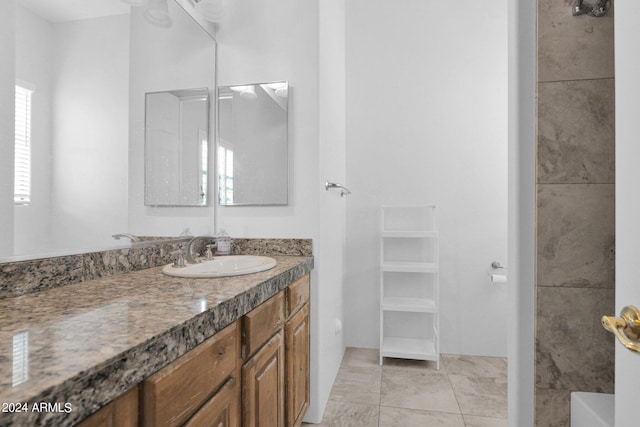 bathroom featuring tile patterned flooring and vanity