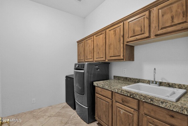 washroom with light tile patterned flooring, cabinets, and sink