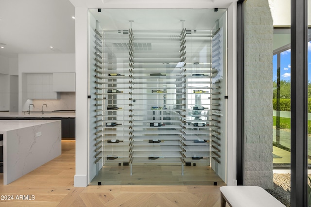 wine cellar with light wood-type flooring