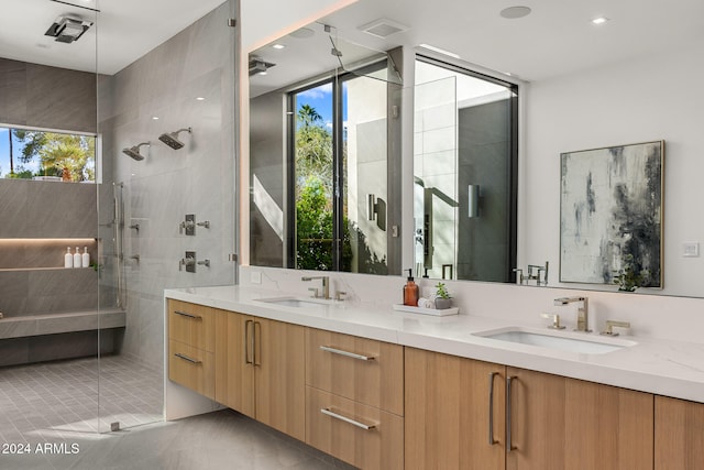 bathroom with walk in shower and vanity