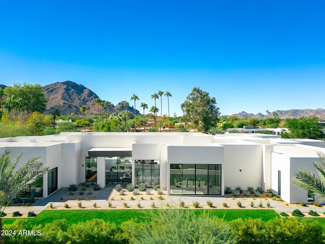 back of property with a mountain view