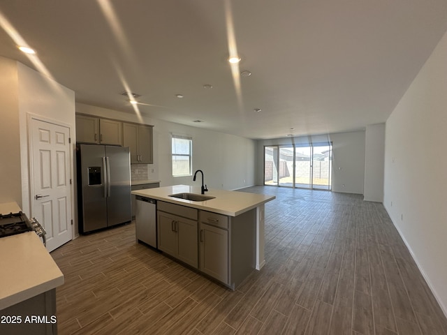 46922 W Coe St, Maricopa, AZ 85139 - kitchen featuring stainless steel appliances, a sink, gray cabinetry, and dark wood-style flooring