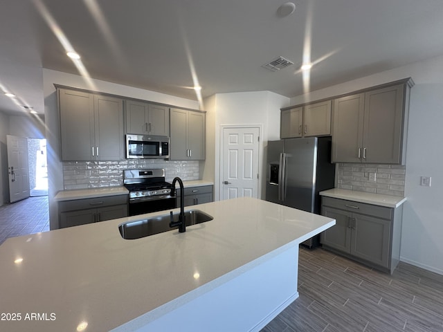 46922 W Coe St, Maricopa, AZ 85139 - kitchen with appliances with stainless steel finishes, gray cabinets, and a sink
