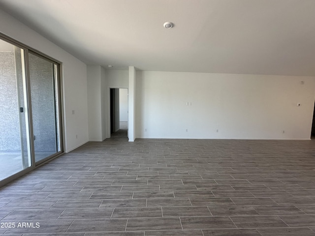 46922 W Coe St, Maricopa, AZ 85139 - unfurnished room featuring dark wood finished floors and baseboards