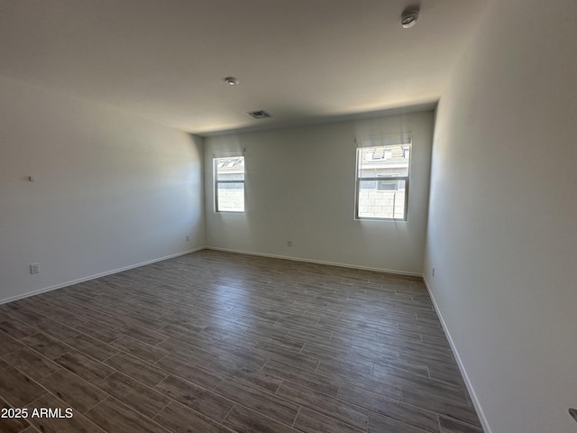 46922 W Coe St, Maricopa, AZ 85139 - unfurnished room featuring dark wood-style floors and baseboards