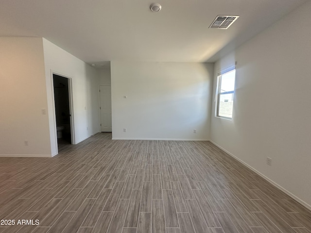 46922 W Coe St, Maricopa, AZ 85139 - empty room featuring wood finished floors and baseboards