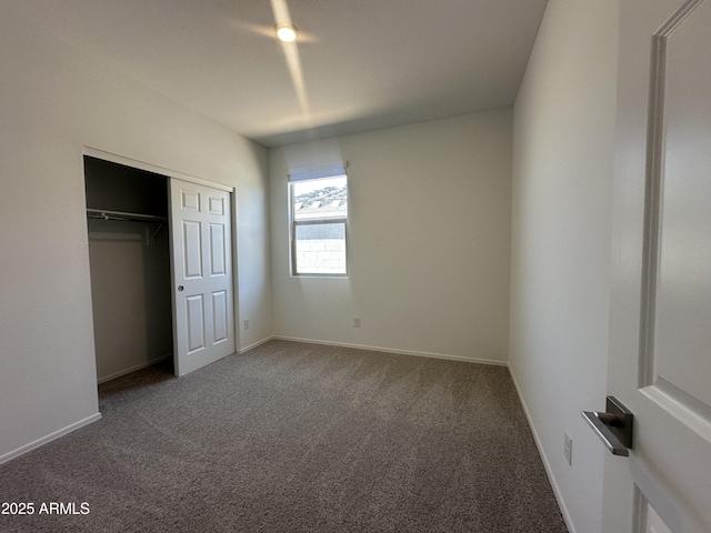 46922 W Coe St, Maricopa, AZ 85139 - unfurnished bedroom featuring carpet flooring, a closet, and baseboards