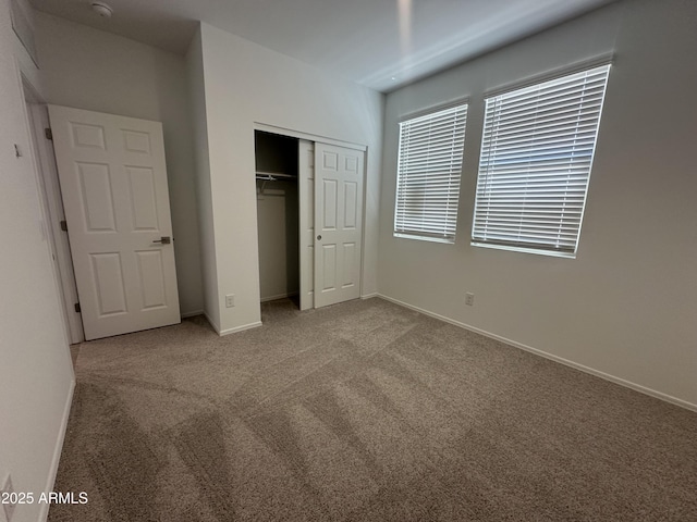 46922 W Coe St, Maricopa, AZ 85139 - unfurnished bedroom featuring carpet flooring, a closet, and baseboards