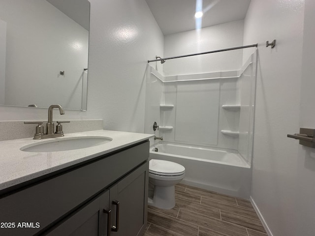 46922 W Coe St, Maricopa, AZ 85139 - full bath featuring wood tiled floors, toilet,  shower combination, vanity, and baseboards