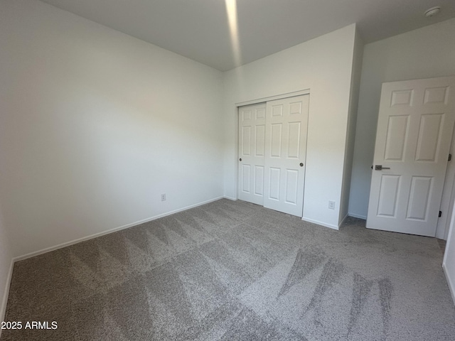 46922 W Coe St, Maricopa, AZ 85139 - unfurnished bedroom with carpet floors, baseboards, and a closet