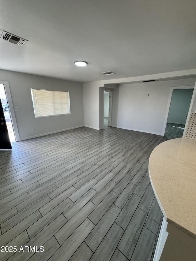 unfurnished living room featuring a wealth of natural light