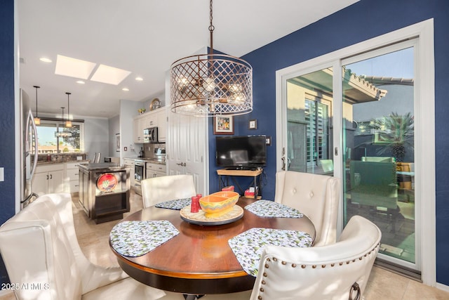 dining area featuring light tile patterned floors, a skylight, and recessed lighting