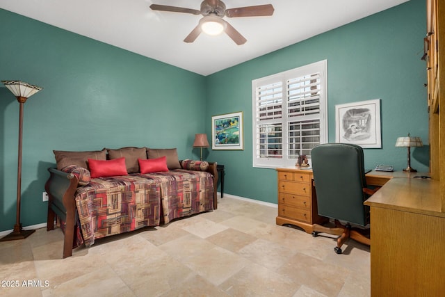 bedroom featuring a ceiling fan and baseboards